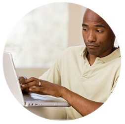 Photo of man viewing computer screen