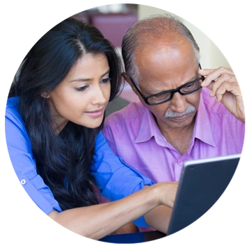 Photo of man and woman looking at a computer screen