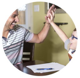 Photo of man and child giving high fives