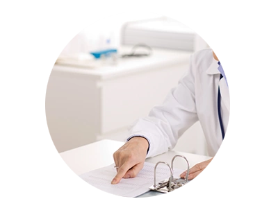 Photo of doctor pointing to chart