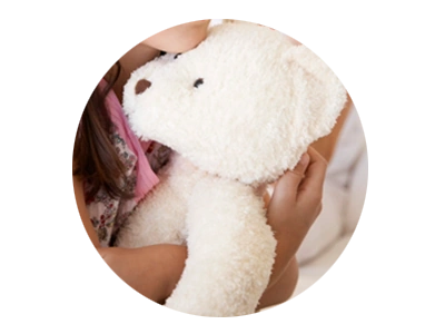 Photo of child holding a teddy bear